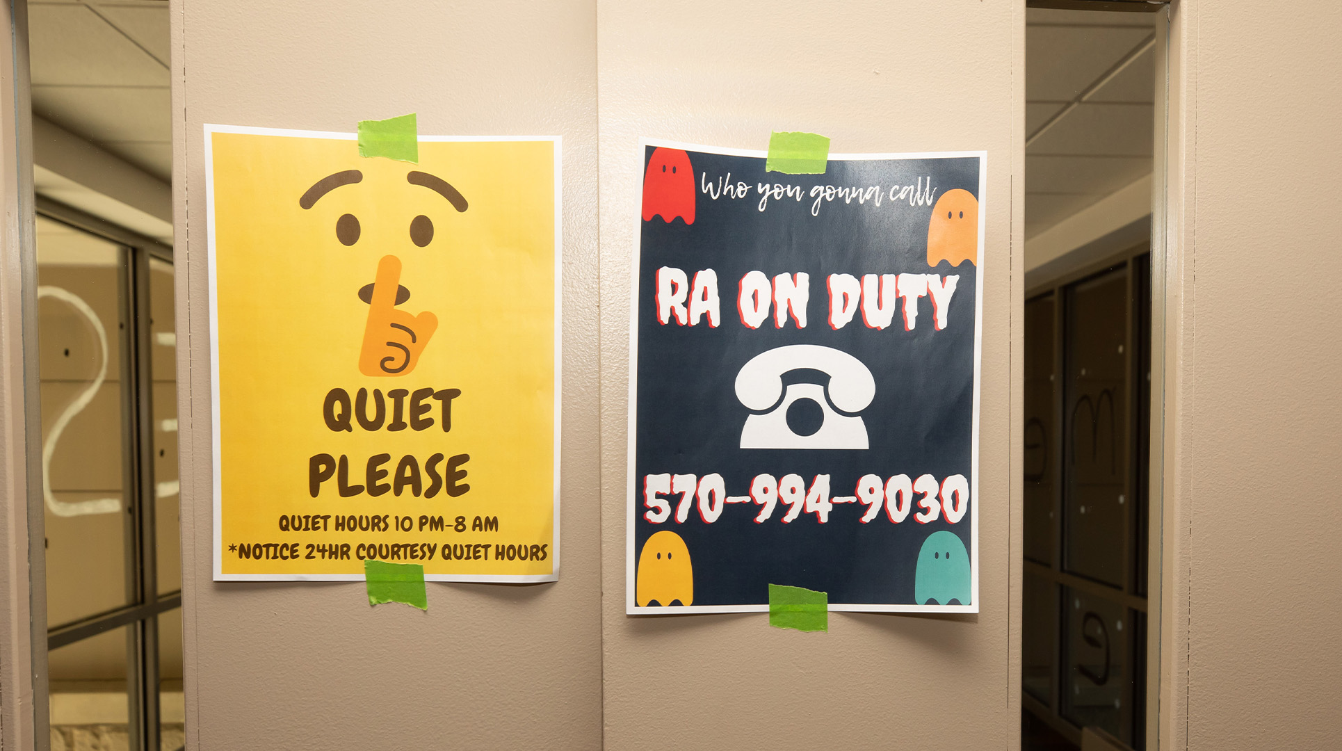 Signs posted on dorm doors with information about the RAs