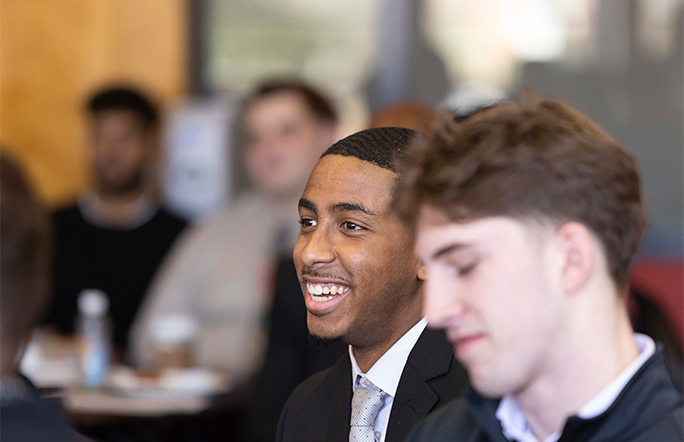 Students listening to a speech