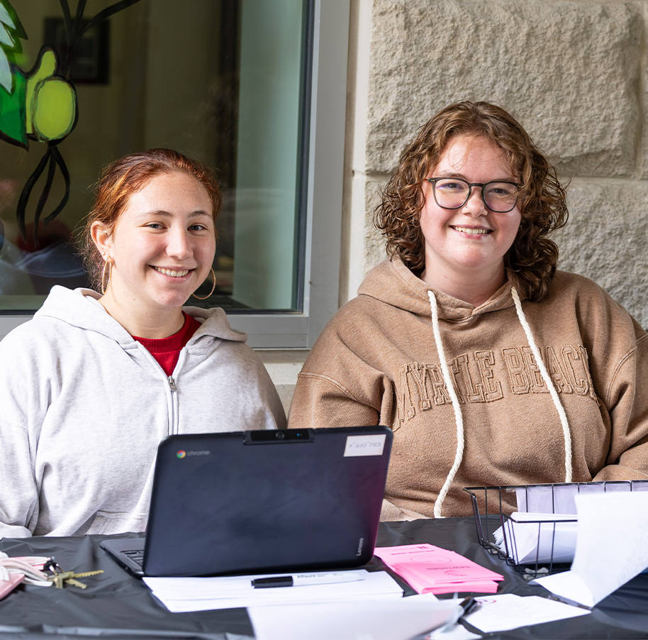 Two students working desk during Move-In Day